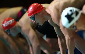 male swimmers starting tournament